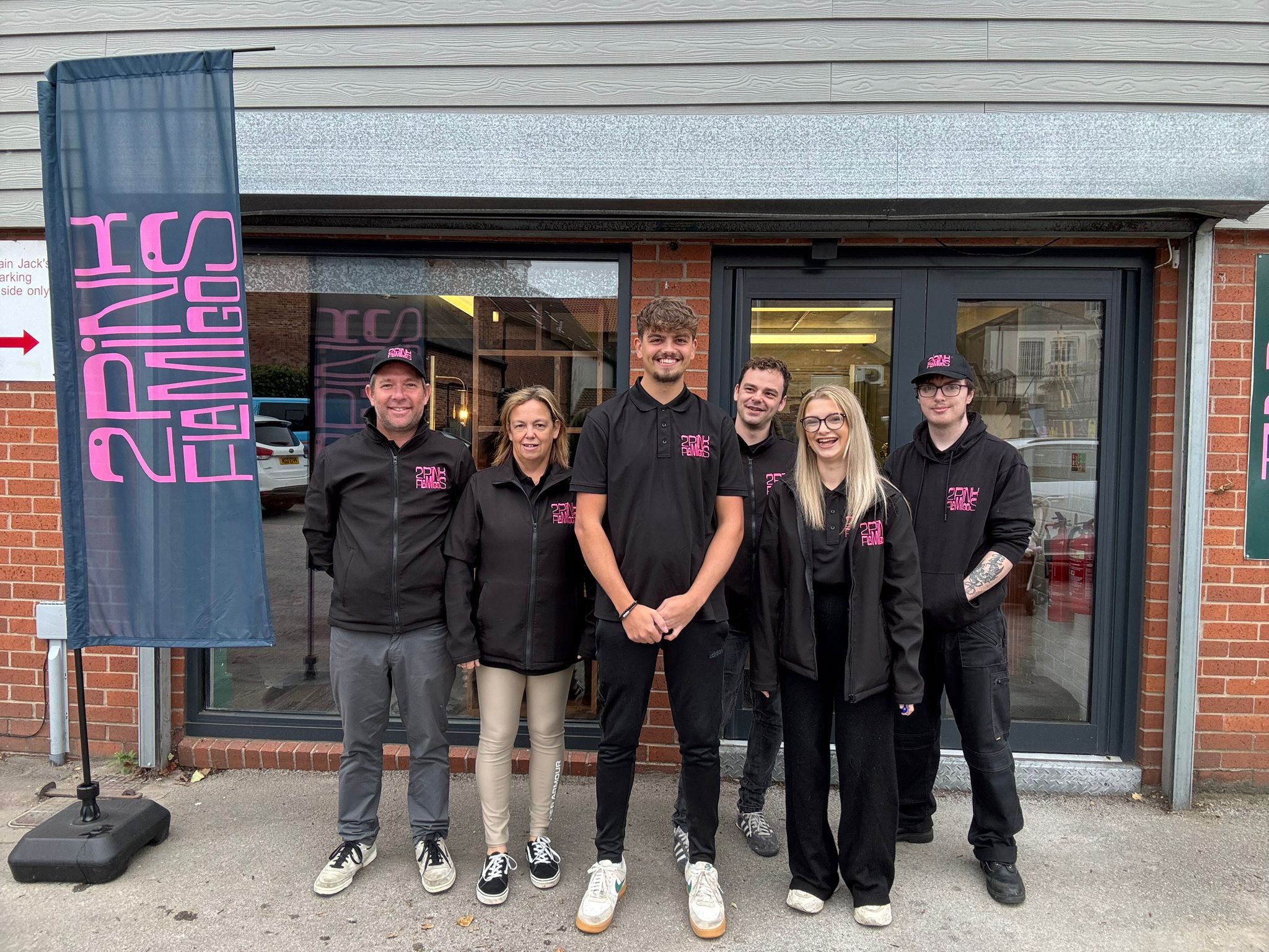 team members at 2 Pink Flamingos furniture store