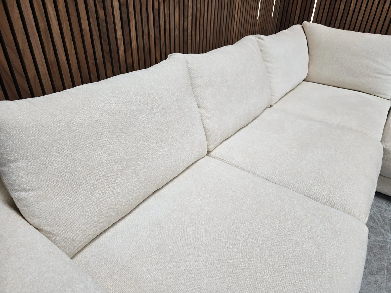 overhead of cushions Large Corner Sofa & Glass Coffee Table In White Cosy Fabric