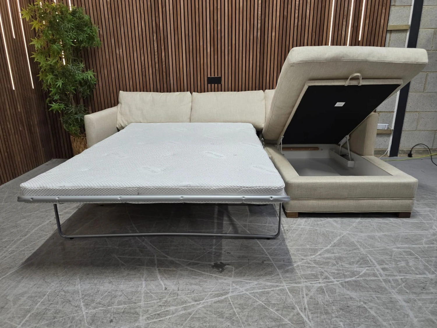 photo of aissa rhf chaise sofa with the bed out and storage compartment up