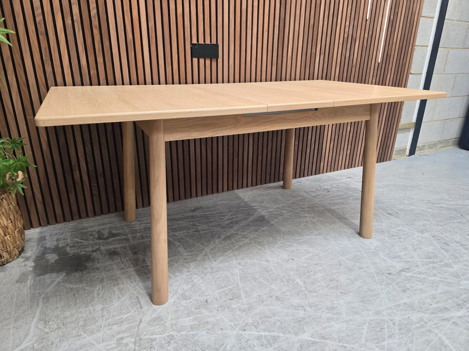 scandinavian style oak extending dining table from the left side