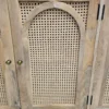 showing the rattan arched door way on the sideboard