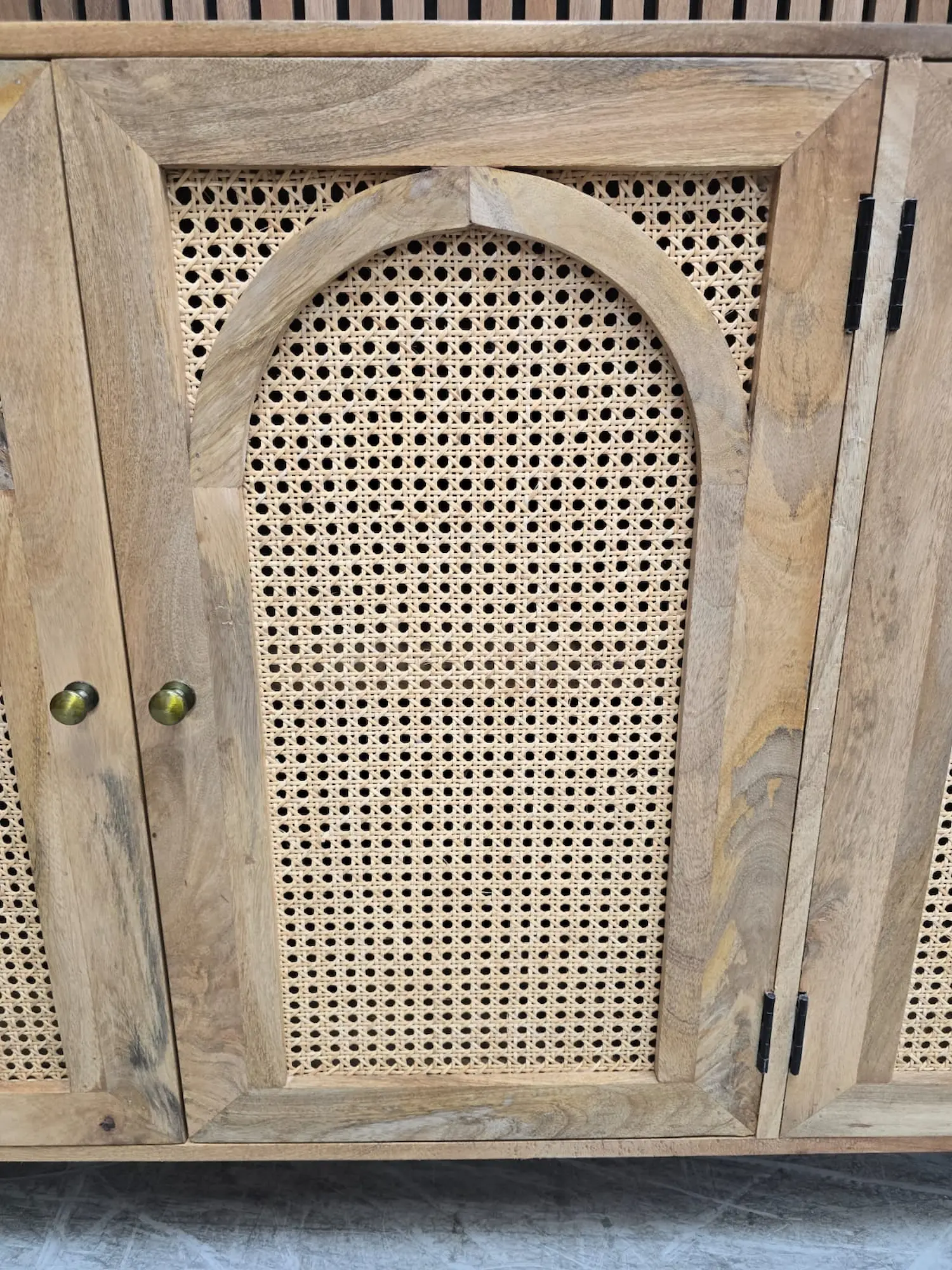 showing the rattan arched door way on the sideboard