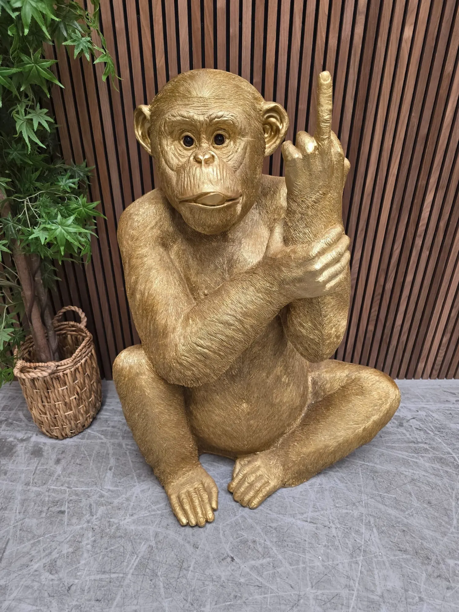 Huge monkey resin statue with his finger up and tongue out