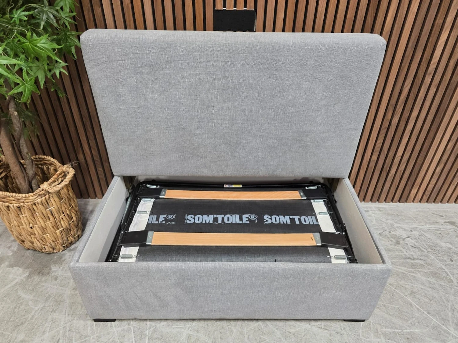 footstool top off showing the bed mechanism tucked away underneath