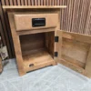 storage compartment open on the bottom of the side cabinet