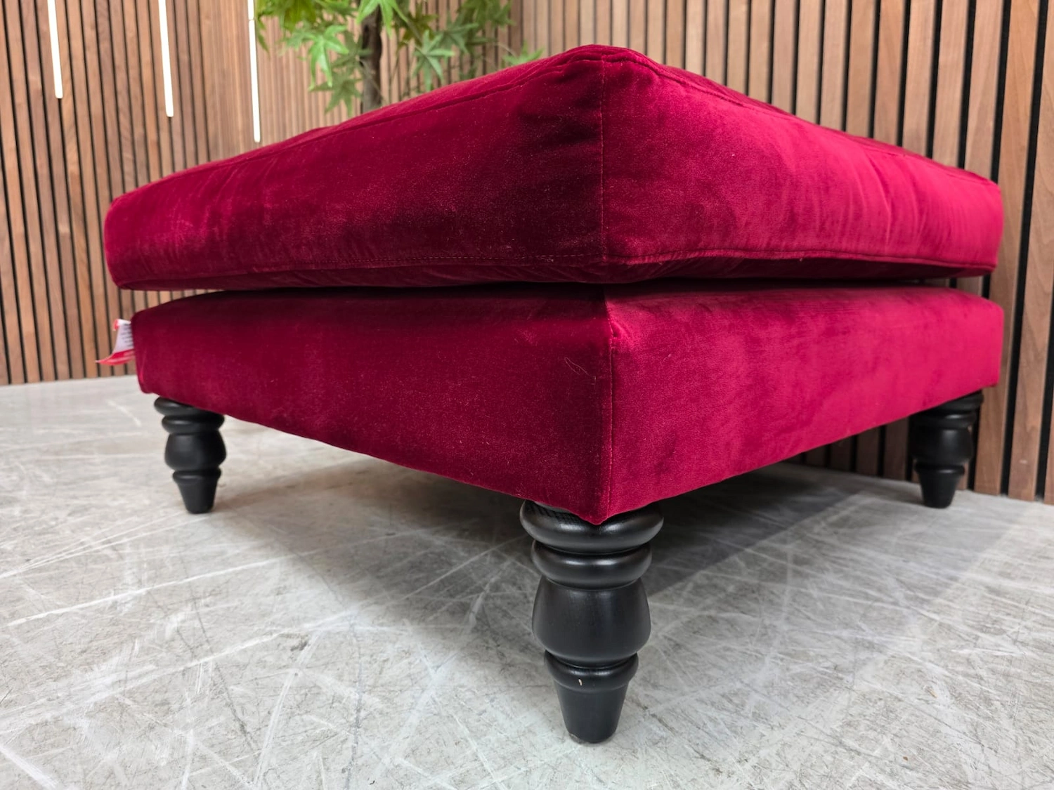 close up of the black turned leg on the isla footstool