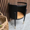 left side of the retro black metal and glass side table