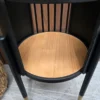close up of the oak shelf that is on the bottom of the table
