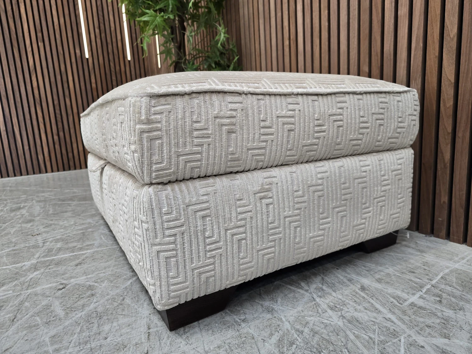 right side profile of the valentino footsool in cream