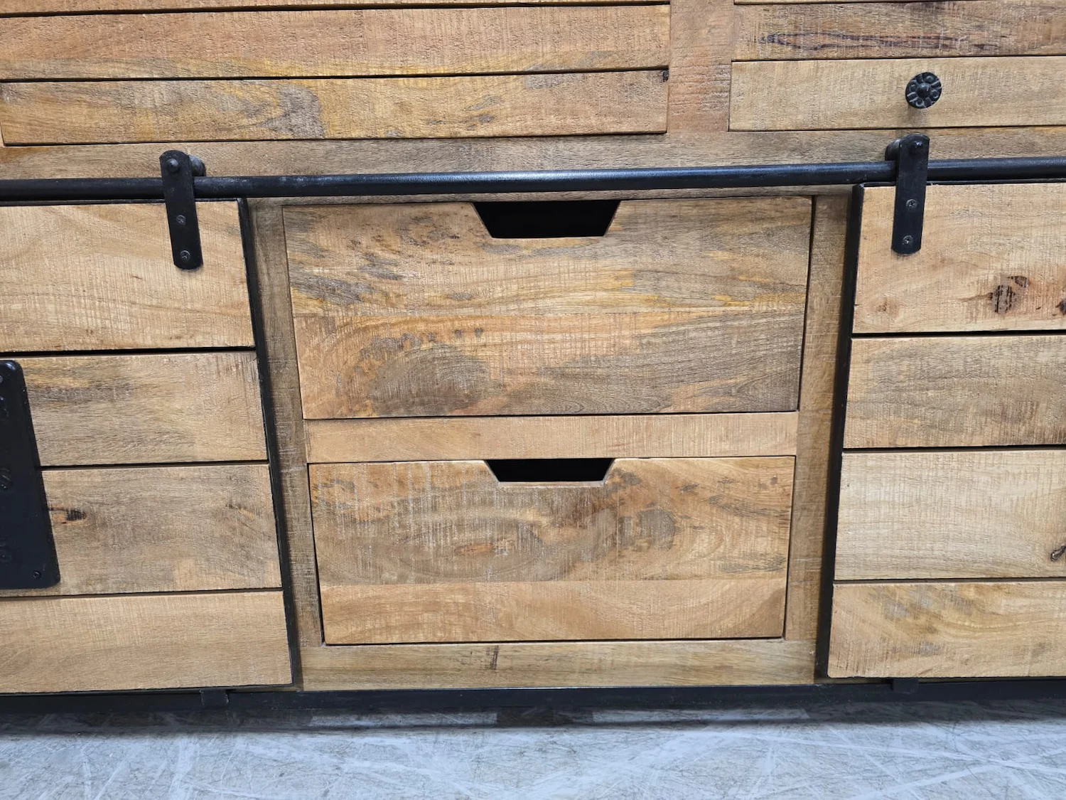 close up photo of the middle drawers on the sideboard