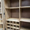 photo of inside the larder cabinet showing the wine rack and shelving