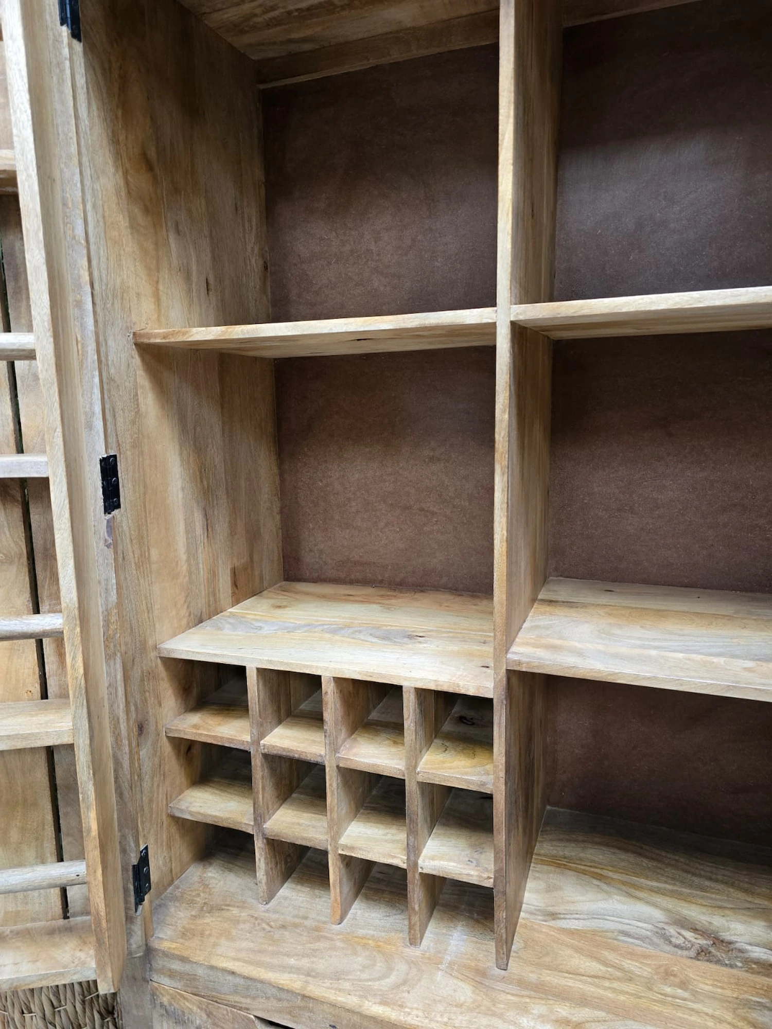 photo of inside the larder cabinet showing the wine rack and shelving