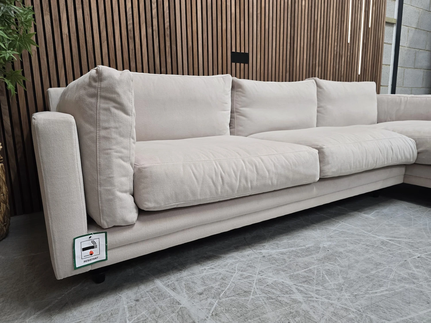 left side front view of the marco chaise in sand