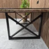 noir railway sleeper table 4 side angle from the right of the black powder coated x shape black legs