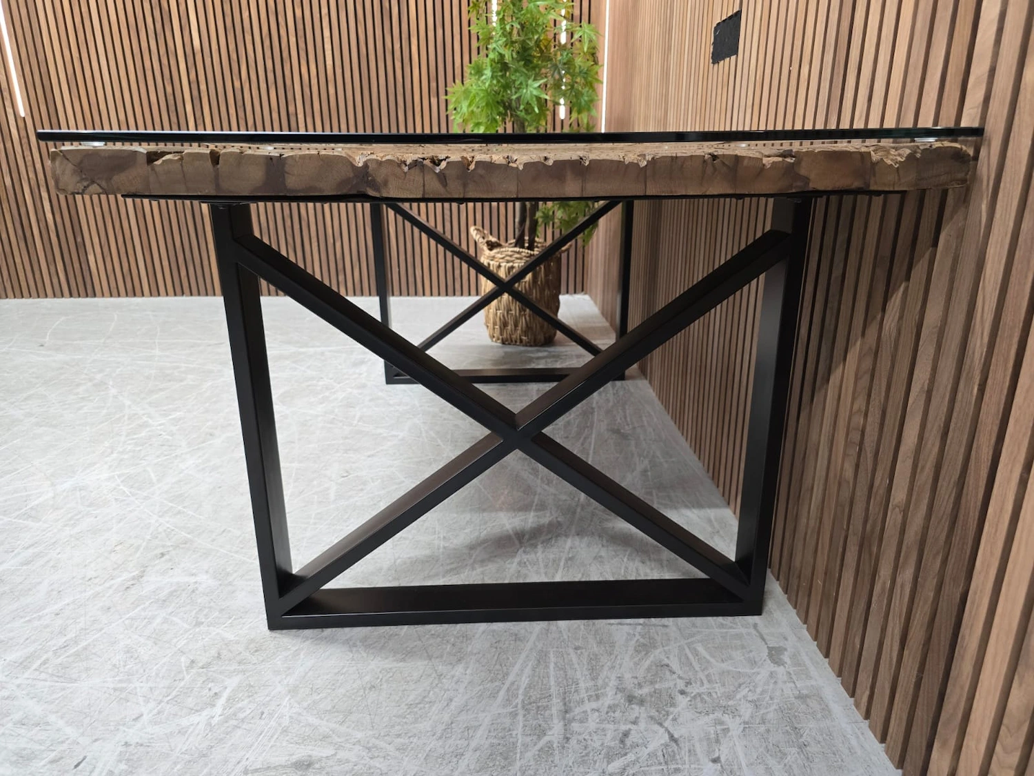 noir railway sleeper table 4 side angle from the right of the black powder coated x shape black legs