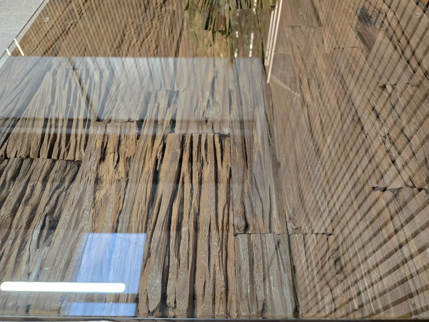 noir railway sleeper table 6 close up of the tempered glass top of the railway sleeper dining table