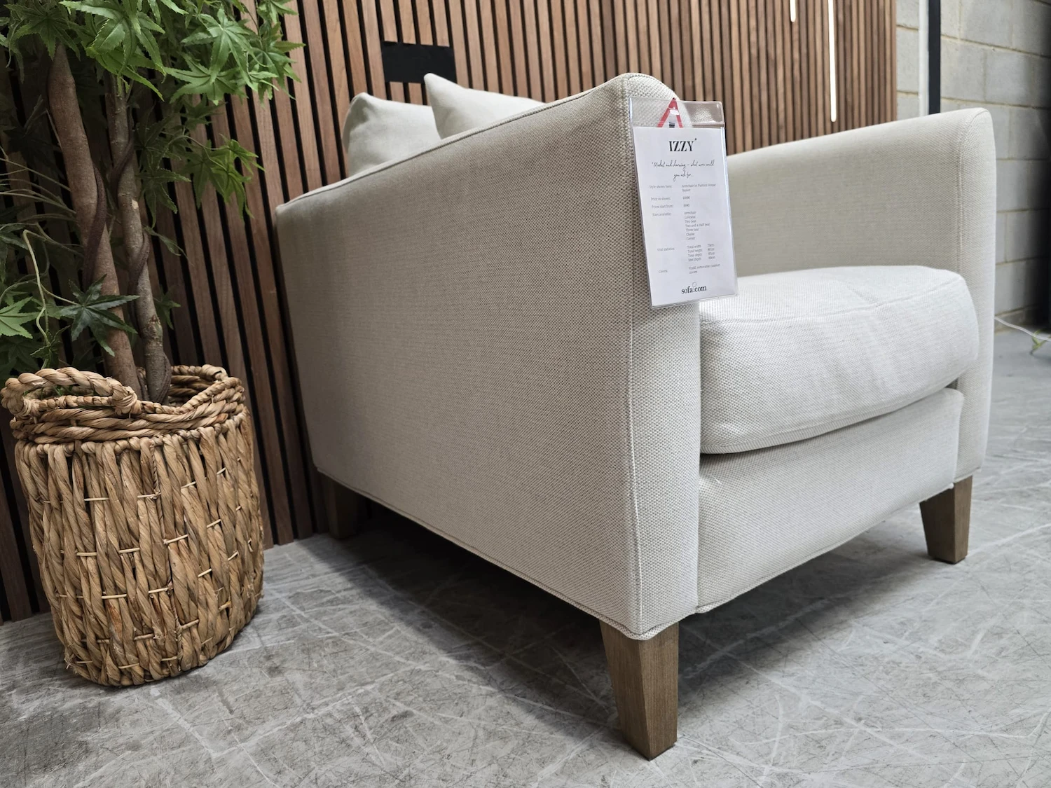 izzy armchair in pumice house basket weave 3 left side profile of the izzy armchair side