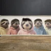 sloths in hoodies framed canvas wall art